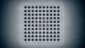 X-ray style BGA inspection showing lighter internal voids in several dark solder balls