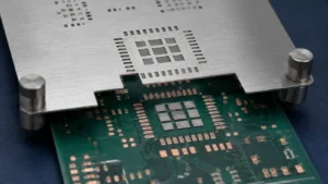Stainless steel SMT stencil above a PCB with fine-pitch apertures and segmented solder paste deposits